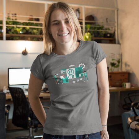 Blonde girl in office environment wearing a t-shirt depicting people building an application
